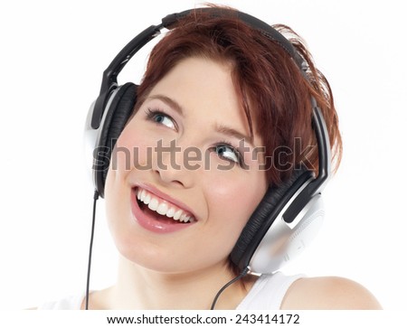 Similar – Blonde woman listening to music with her headphones