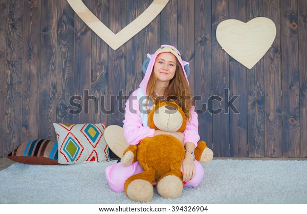 girl in teddy bear suit