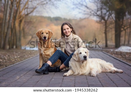 Similar – Image, Stock Photo Attractive womanon a rural path with dogs at sunset