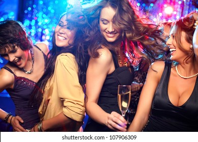 Cheerful girls living it up on the dance floor - Powered by Shutterstock