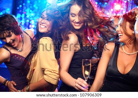 Cheerful girls living it up on the dance floor