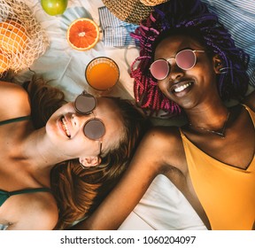 Cheerful Girls In Swimsuit Sun Tanning Together