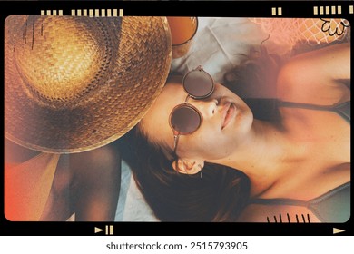 Cheerful girls in swimsuit sun tanning together. African and caucasian young women tanning at the beach in the summer. Diverse friends on a summer holiday vacation on a tropical beach. - Powered by Shutterstock