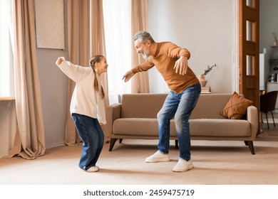 A cheerful grandfather engages in a playful dance with his young granddaughter in the warmth of their living room, highlighted by the soft daylight streaming in through the curtains - Powered by Shutterstock