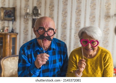 Cheerful Grandparents With Cute Glasses Senior People Support Concept Living Room Medium Closeup . High Quality Photo