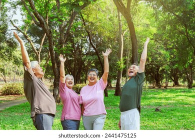 Cheerful group asian elderly people retirees in good health happiest doing recreational activities playing sports exercising having fun shady garden in the morning good mood and good mental health. - Powered by Shutterstock