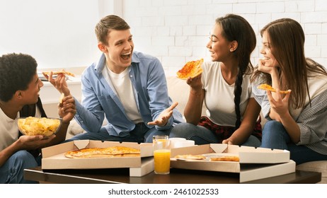 A cheerful group of four young friends is gathered in a comfortable living room, enjoying slices of pizza and engaging in a lively conversation - Powered by Shutterstock