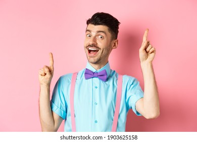 Cheerful Guy With French Moustache Pitching An Idea, Dancing And Raising Fingers Up, Having Solution, Standing Happy Over Pink Background