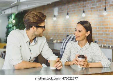 Cheerful Guy And Girl Resting In Cafeteria