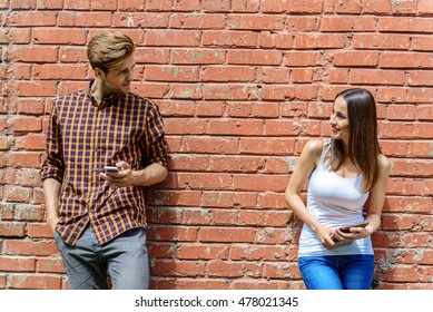 Cheerful Guy And Girl Talking On Street