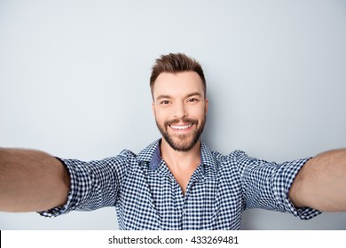 Cheerful Handsome Bearded Young Man Making Selfie