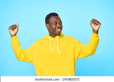 Cheerful handsome man of African appearance studio smile casual clothes