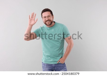 Similar – Image, Stock Photo Funny young man on brick wall with open hands