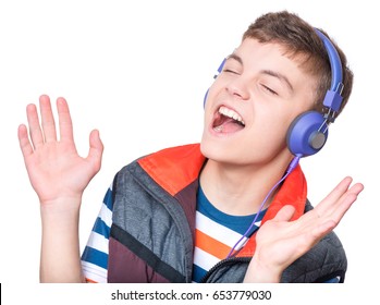 Cheerful Handsome Teen Boy With Headphones Listening To Music, Isolated On White Background. Emotional Portrait Of Happy Cute Child 13-15 Year Old - Leisure, Children And Technology Concept.