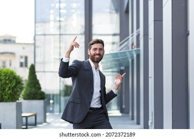 Cheerful Happy Business Man Dancing Walk The City Street Background A Modern Office Building Outside, Outdoors Funny Successful Businessman In Suit Celebtes Victory