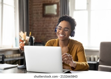 Cheerful Happy Professional Influencer, Blogger Wearing Headphones, Glasses, Giving Live Broadcasting, At Audio Equipment Microphone, Laptop In Sound Studio, Smiling At Webcam, Talking To Audience