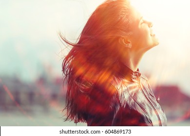 Cheerful Happy Young Adult Girl In Sunlight Rays And Wind Hair