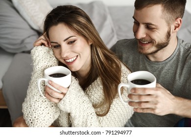 Cheerful heterosexual couple drinking coffee 
 - Powered by Shutterstock