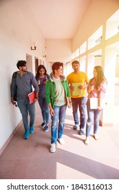 Cheerful Indian Asian Young Group Of College Students Or Friends Walking In Campus Corridor Or On Stairs