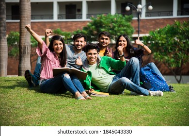 Cheerful Indian Asian Young Group Of College Students Or Friends Laughing Together While Sitting, Standing Or Walking In Campus