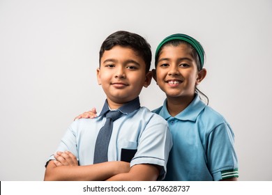 Cheerful Indian School Kids In Uniform Standing Isolated Over White Background