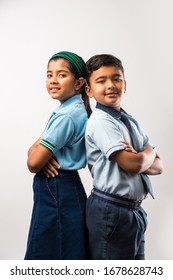 Cheerful Indian School Kids In Uniform Standing Isolated Over White Background