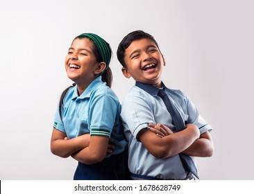 Cheerful Indian School Kids In Uniform Standing Isolated Over White Background