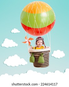 Cheerful Kid On Hot Air Balloon In The Sky