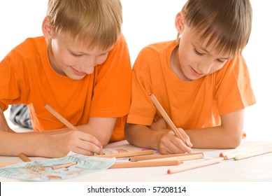 Cheerful Kids Drowing In Albums