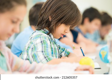 Cheerful Kids Learning In School Classroom