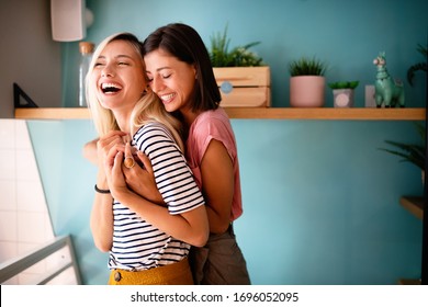 Cheerful lesbians embrace passioantely and have fun together - Powered by Shutterstock