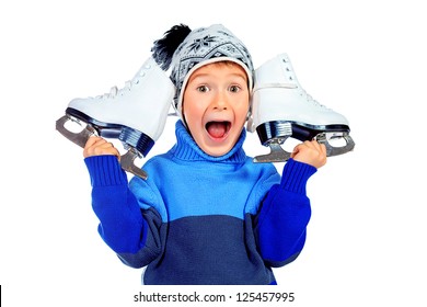 Cheerful little boy in warm sweater and hat  holding figure skates. Isolated over white background
