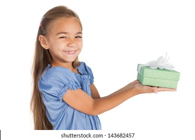 Cheerful little girl giving a present on white background