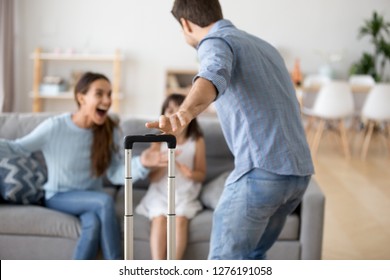 Cheerful Loving Mom And Kid Daughter Excited To Meet Dad With Suitcase Coming Home Arriving From Long Trip, Daddy Hurrying To Hug Wife And Child, Welcome Back Father, Happy Family Reunion Concept