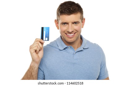 Cheerful Man Holding Credit Card. Closeup Shot