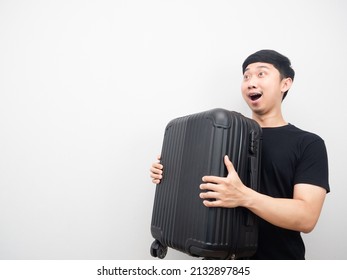 Cheerful Man Holding Luggage Feeling Excited Looking At Copy Space