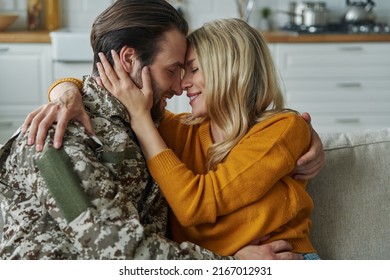 Cheerful Man In Military Form Hugging His Wife After Coming Home From War