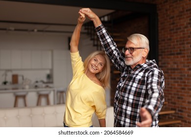 Cheerful Mature Couple Of People Dancing. Celebrating Wedding Anniversary, Love And Romance. Happy Senior Husband And Wife On A Date.