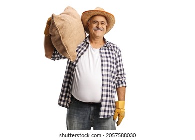 Cheerful Mature Farmer Carrying A Big Burlap Sack On His Shoulder Isolated On White Background