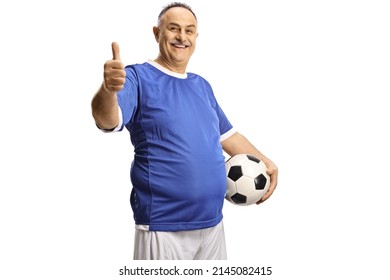 Cheerful mature man in a football jersey holding a ball and gesturing thumbs up isolated on white background