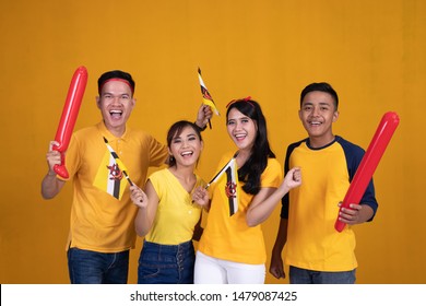 cheerful men and woman supporting brunei nation - Powered by Shutterstock