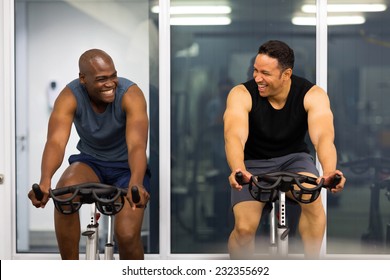 cheerful men working out in gym - Powered by Shutterstock