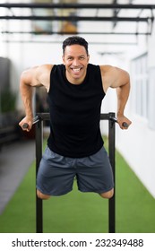 Cheerful Middle Aged Man Exercising In Health Club