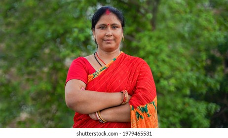 Cheerful Middle-aged Indian Woman Posing With Folded Hand In Tradition Saree, Isolated Over Outdoor Background