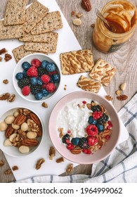 Cheerful Morning Table Mess, Greek Yoghurt, Berries And Nuts For Healthy Breakfast