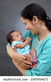 Cheerful Mother And Newborn Baby