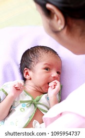 Cheerful Mother And Newborn Baby