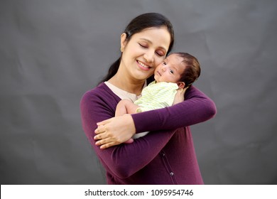 Cheerful Mother And Newborn Baby