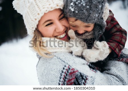 Similar – Image, Stock Photo Mother and toddler with mobile phone in hand