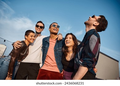 cheerful multicultural friends with fashionable sunglasses having fun together at rooftop party - Powered by Shutterstock